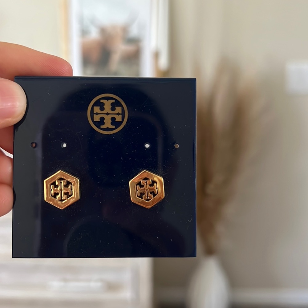 Tory Burch gold earrings.